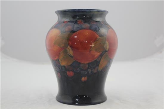 Two William Moorcroft pomegranate pattern vases, c.1916-25, 19cm, latter heavily repaired
